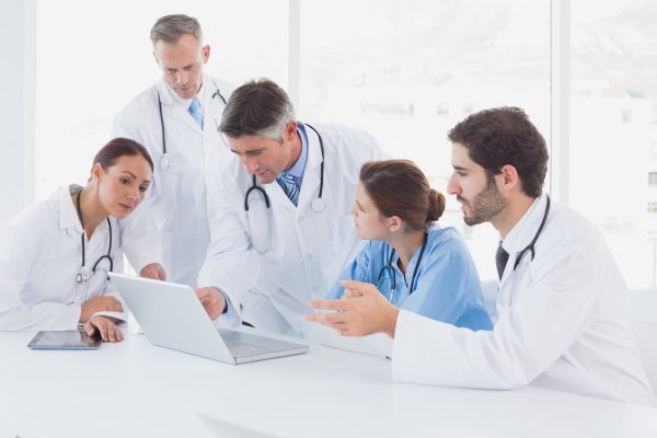 Medical team looking at results on the dashboard